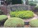 Weatherstone community sign with decorative brick and yellow flowering plants at 1601 Castalia Dr, Cary, NC 27513