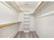 A well-organized walk-in closet with shelving and rods at 1601 Castalia Dr, Cary, NC 27513