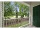 Scenic balcony view overlooking lush greenery and a golf course, framed by a white railing at 1723 Kudrow Ln, Morrisville, NC 27560