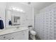 Clean bathroom featuring a white vanity, a patterned shower curtain, and modern fixtures at 1723 Kudrow Ln, Morrisville, NC 27560