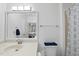Bright bathroom with a white vanity, a patterned shower curtain, and a clear view to the bedroom at 1723 Kudrow Ln, Morrisville, NC 27560