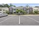 Charming two-story condo with brick and white siding and well-maintained landscaping at 1723 Kudrow Ln, Morrisville, NC 27560