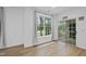 Bright living room with wood floors, large windows, and glass sliding door leading to the outside at 1723 Kudrow Ln, Morrisville, NC 27560