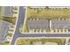 Aerial view of well-maintained townhomes, parking, green spaces, and surrounding neighborhood at 19 Willow Green Dr, Clayton, NC 27527