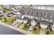 Aerial view of a row of townhomes with well-manicured lawns at 19 Willow Green Dr, Clayton, NC 27527