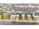Aerial view of a street of townhomes with well-manicured lawns at 19 Willow Green Dr, Clayton, NC 27527