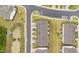 Aerial view of community showing townhomes, parking, green spaces, and small pond at 19 Willow Green Dr, Clayton, NC 27527