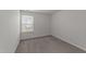 Bright bedroom with a window view, carpeted floors and neutral walls at 19 Willow Green Dr, Clayton, NC 27527