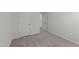 Neutral bedroom features carpeted floor, base molding, and a convenient closet for ample storage space at 19 Willow Green Dr, Clayton, NC 27527
