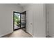 Bright foyer with modern flooring, white trim, and a welcoming entry door at 19 Willow Green Dr, Clayton, NC 27527