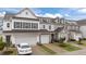 Charming townhome with a two-car garage, and well manicured lawn at 19 Willow Green Dr, Clayton, NC 27527