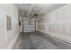 Spacious two car garage with concrete flooring, insulated garage door, and drywall at 19 Willow Green Dr, Clayton, NC 27527