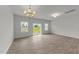 Bright living room with wood floors and sliding glass doors leading to the backyard at 19 Willow Green Dr, Clayton, NC 27527