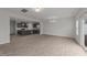 Open-concept living area features wood flooring and a modern kitchen with stainless appliances at 19 Willow Green Dr, Clayton, NC 27527