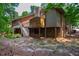 Spacious backyard with a deck and stairs, offering plenty of outdoor space at 200 W Woodcroft Pkwy # 52A, Durham, NC 27713