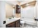 Bathroom featuring a combination tub and shower with wood cabinets at 200 W Woodcroft Pkwy # 52A, Durham, NC 27713