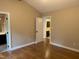 Bedroom with vaulted ceiling features an attached bathroom with vanity at 200 W Woodcroft Pkwy # 52A, Durham, NC 27713