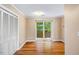 Cozy bedroom with hardwood floors, a double closet, and a large window at 200 W Woodcroft Pkwy # 52A, Durham, NC 27713