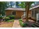 Inviting brick home featuring a front entrance with well-maintained landscaping and walkway at 200 W Woodcroft Pkwy # 52A, Durham, NC 27713