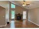 Cozy living room featuring hardwood floors, a brick fireplace, and vaulted ceilings offering ample natural light at 200 W Woodcroft Pkwy # 52A, Durham, NC 27713