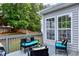 Inviting back deck is furnished with comfortable seating and stylish decor at 2003 Pilot Mountain Ct, Apex, NC 27502