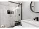 Modern bathroom showcasing sleek glass shower, marble tile, and stylish black fixtures at 2003 Pilot Mountain Ct, Apex, NC 27502