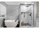 Luxurious bathroom featuring a freestanding tub, glass-enclosed shower, and elegant finishes for a relaxing experience at 2003 Pilot Mountain Ct, Apex, NC 27502