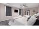 Shared bedroom features plush carpet, natural lighting, and two full-sized beds, creating a comfortable retreat at 2003 Pilot Mountain Ct, Apex, NC 27502
