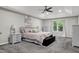 Spacious bedroom with a tray ceiling, neutral walls, and large windows at 2003 Pilot Mountain Ct, Apex, NC 27502