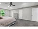 Neutral bedroom with large window, carpet and ample closet space at 2003 Pilot Mountain Ct, Apex, NC 27502