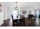 Spacious dining room with hardwood floors, modern lighting, and stylish decor at 2003 Pilot Mountain Ct, Apex, NC 27502