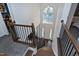 Grand foyer with high ceilings, a statement window, and hardwood stairs at 2003 Pilot Mountain Ct, Apex, NC 27502