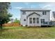 Exterior view of the home with a spacious back yard and privacy fence at 2003 Pilot Mountain Ct, Apex, NC 27502