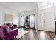 Inviting living room featuring hardwood floors, ample natural light, and stylish decor at 2003 Pilot Mountain Ct, Apex, NC 27502