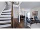 Open-concept living room features hardwood floors and a staircase at 2003 Pilot Mountain Ct, Apex, NC 27502