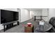 Second-floor loft featuring a large TV and plenty of space for seating at 2003 Pilot Mountain Ct, Apex, NC 27502