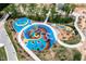 Colorful aerial view of the community playground featuring a variety of play structures and soft surfaces at 2003 Pilot Mountain Ct, Apex, NC 27502