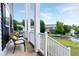 Inviting porch view showcasing comfortable seating and a glimpse of the serene neighborhood at 2003 Pilot Mountain Ct, Apex, NC 27502