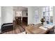 Cozy sunroom featuring a view to an open concept dining and living space at 2003 Pilot Mountain Ct, Apex, NC 27502