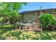Large backyard showcases mature trees and a patio area, perfect for outdoor entertaining at 202 Oak Tree Dr, Chapel Hill, NC 27517