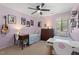 Bright bedroom showcases twin beds with desks, art, and natural light from a window, creating an ideal space at 202 Oak Tree Dr, Chapel Hill, NC 27517
