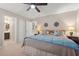 Comfortable bedroom features soft carpet, neutral walls, ceiling fan and ensuite bathroom access at 202 Oak Tree Dr, Chapel Hill, NC 27517