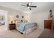 Comfortable bedroom featuring neutral walls, soft carpet, and a ceiling fan for added air circulation at 202 Oak Tree Dr, Chapel Hill, NC 27517
