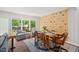 Inviting dining area with ample natural light, hardwood floors, and climbing wall at 202 Oak Tree Dr, Chapel Hill, NC 27517