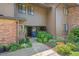 Charming townhouse featuring a well-maintained yard with mature shrubs and inviting front entrance at 202 Oak Tree Dr, Chapel Hill, NC 27517