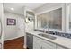 Kitchen featuring a stainless steel sink, stone countertops and white cabinets at 202 Oak Tree Dr, Chapel Hill, NC 27517