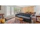 Bright living room featuring a comfortable sofa, a climbing wall, hardwood floors, and natural light at 202 Oak Tree Dr, Chapel Hill, NC 27517