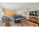 Open-concept living area featuring a sofa, climbing wall, hardwood floors, and plenty of natural light at 202 Oak Tree Dr, Chapel Hill, NC 27517