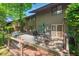 Inviting patio with outdoor seating, a grill, and a canoe in view, perfect for entertaining at 202 Oak Tree Dr, Chapel Hill, NC 27517