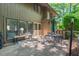 Charming patio with outdoor seating, mature trees, and convenient access to the home's interior at 202 Oak Tree Dr, Chapel Hill, NC 27517